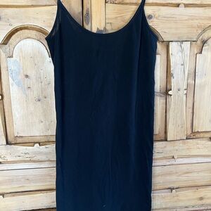 Black long tank top. 30 inches long, 15 inches underarm to underarm.